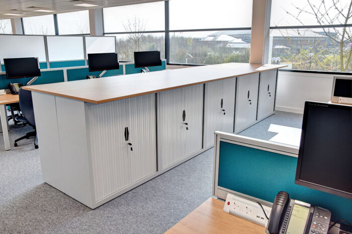 Office tambour storage with oversailing top