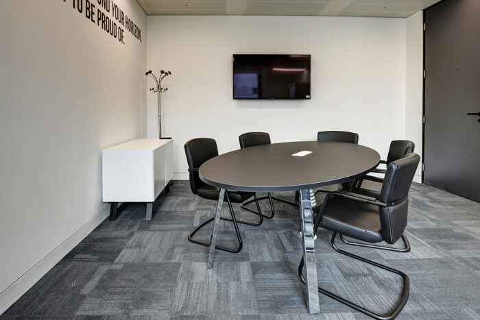 Oval meeting room table with black laminate